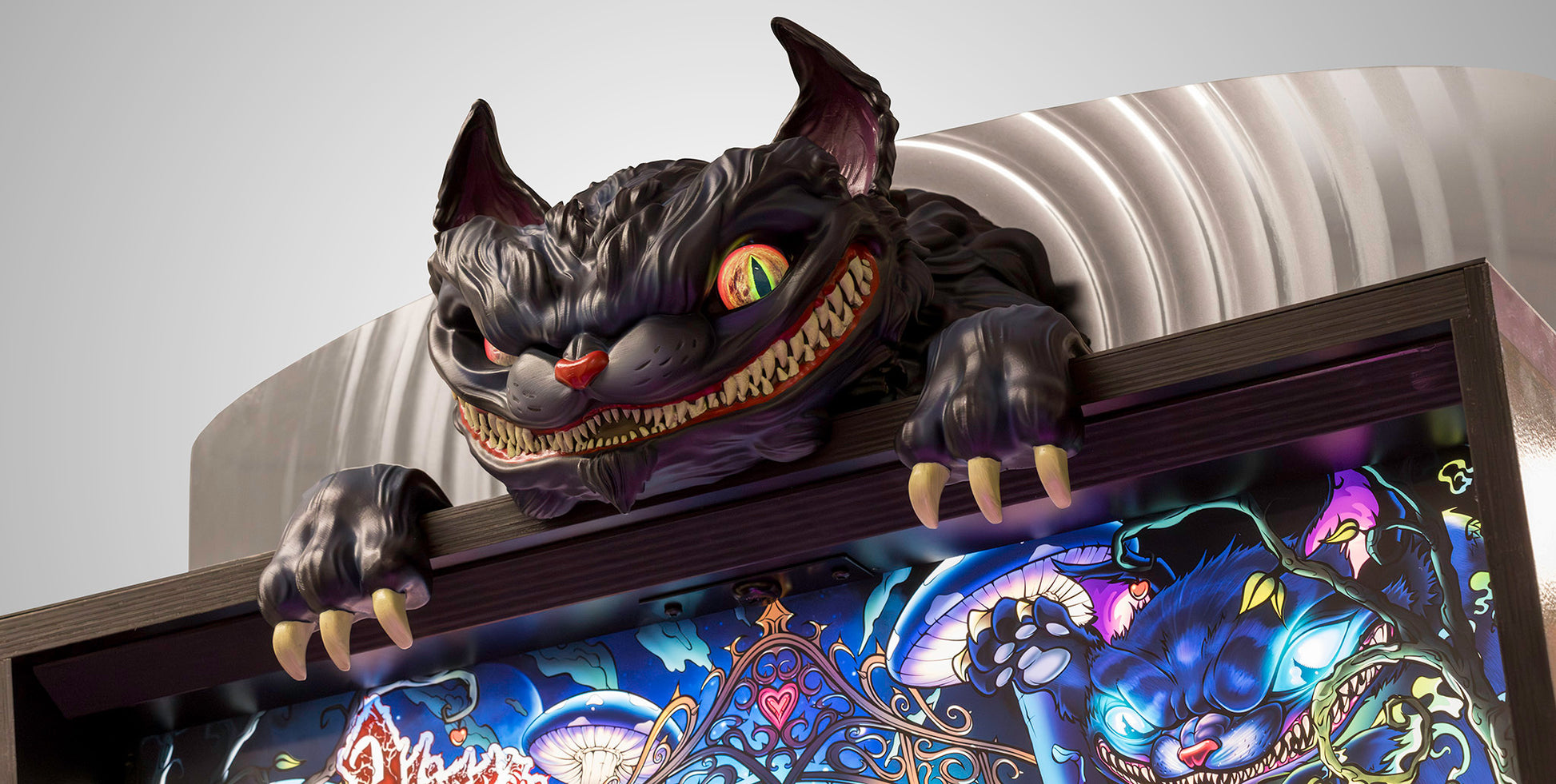 Alice's Adventures in Wonderland pinball — Cheshire Cat sculpt over the backbox
